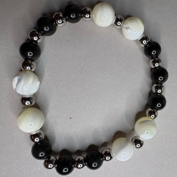 This combination symbolizes harmony—balancing strength and serenity. - Picture 3 of 3